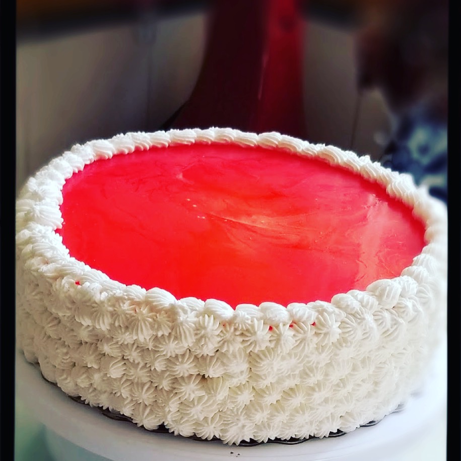 Orange cake with jello and whipped cream